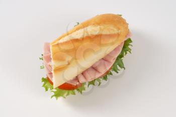 French bread sandwich with ham on white background