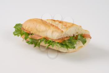 sandwich with smoked salmon on white background