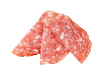 slices of dry salami arranged on white background