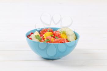 Bowl of citrus fruit salad with pomegranate seeds