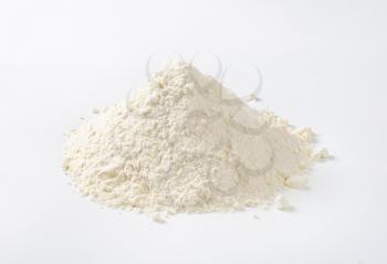 pile of wheat flour on white background