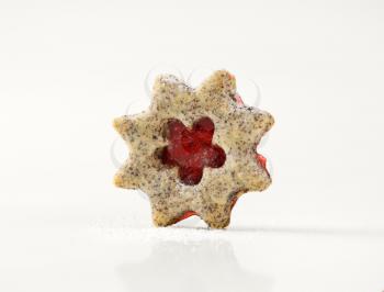 shortbread cookie with jam filling on white background