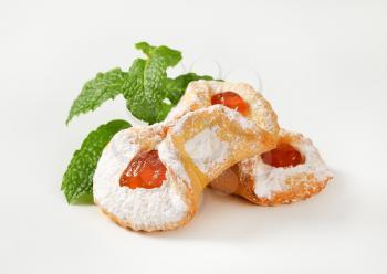 cookies with apricot jam filling on white background