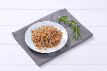 plate of cooked buckwheat on grey place mat