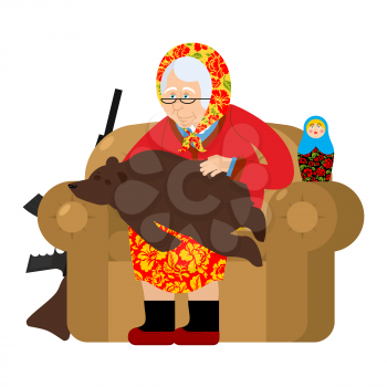Russian Grandmother and bear are your pets. old woman in an armchair with grizzly. grandma from Russia in felt boots. Traditional national clothes
