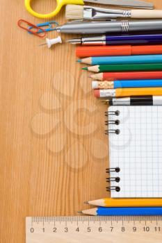 back to school and supplies on wood background