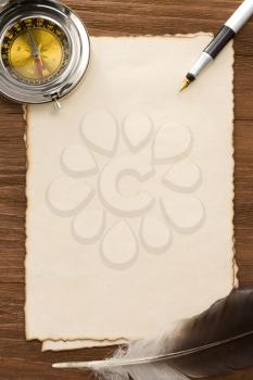 ink pen and compass on parchment background texture