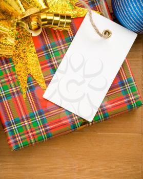 christmas gift box and price tag near christmas balls