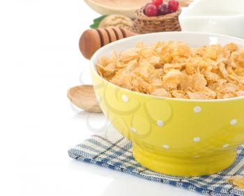 Bowl of corn flakes and milk isolated on white background
