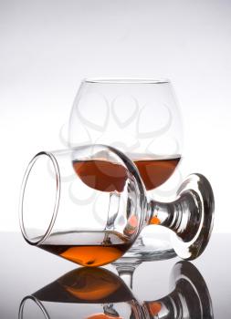 cognac glass with brandy on white