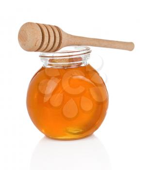 glass pot full of honey isolated on white background