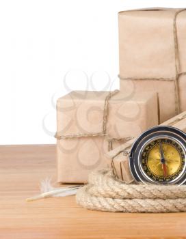 parcel wrapped box and rope on wood isolated over white background