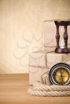 parcel wrapped box and rope on wood board background
