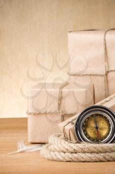 parcel wrapped with brown paper tied with rope on wood background