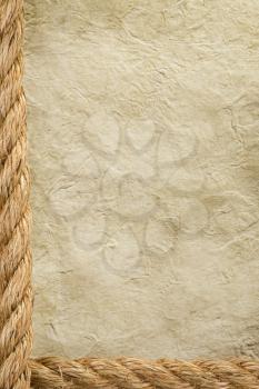 ship ropes and parchment as old paper background