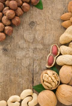 set of nuts fruit on wood background texture