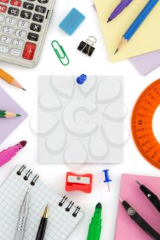 school supplies and note paper on white background