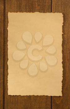 old parchment at wooden background texture