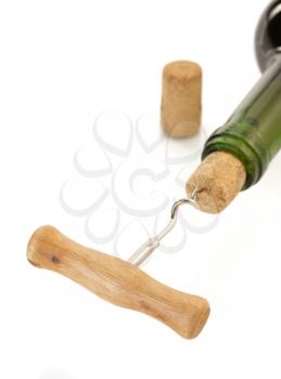 corkscrew and wine bottle isolated on white background