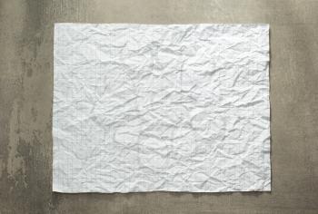 wrinkled paper at wall background