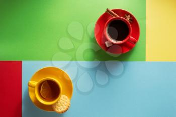 cup of coffee and tea at colorful background