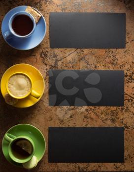 cup of coffee, tea and cacao at abstract background