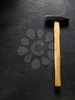 hammer tool at black background texture