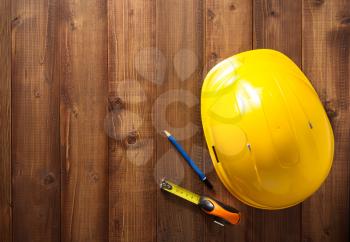 construction tools on wooden background