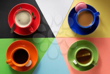 cup of coffee, cacao and tea at abstract colorful background