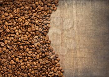 coffee beans on wooden table background, top view