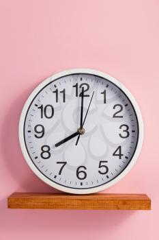 wall clock at abstract background surface