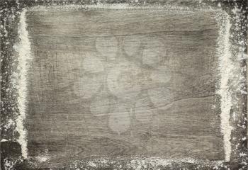 wheat flour on wooden background, top view