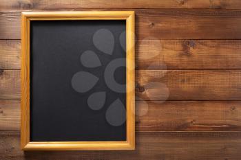 photo picture frame at wooden background wall