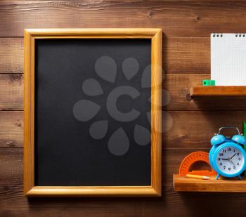 school supplies and tools at wall wooden shelf