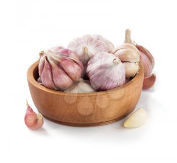 garlic in bowl isolated on white background