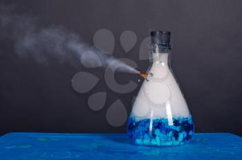 Blue bottle with dry ice soars.
A chemical reaction under pressure.

