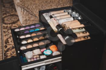 Palette of paints and tones for a make-up, a convenient chest.
