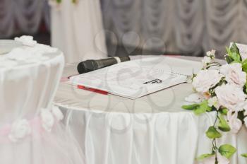 Table with documents for wedding.