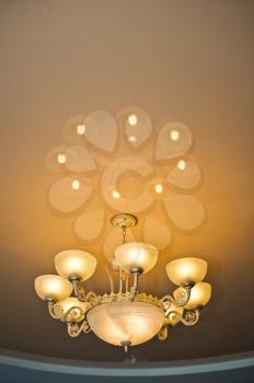 Beautiful beige lamp about reflection in a ceiling.