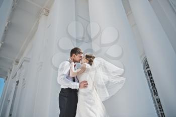 Newlyweds kissing at the Church.