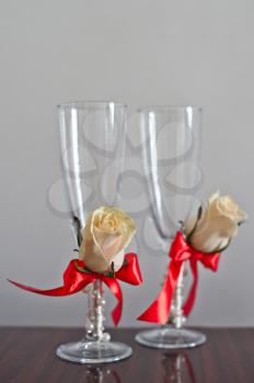 Glasses decorated with red and beige tapes.