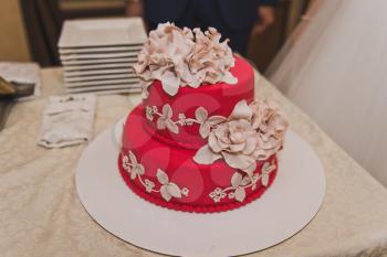 Great wedding cake with beige flowers.