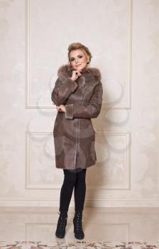 Advertising stylish and beautiful models of winter womens clothing.