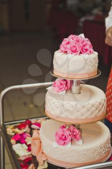 Wedding cake three tier with flowers.