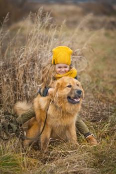 The child climbed astride his big watchdog.
