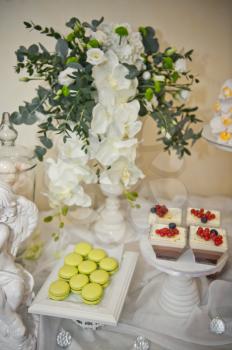 Table with sweet treats for guests.