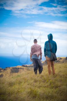 two men on the edge of the Rano Kau volcano, Easter island, Chile, South America