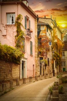 Montmartre, France. Street with houses. Sunset in Paris