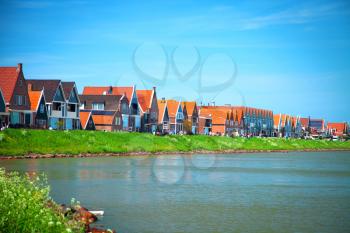 fishing village of Volendam in Holland in the summer by the sea. Made in the style of retro vintage instagram