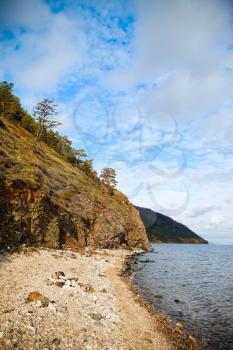 Island on Lake Baikal in the autumn. The most beautiful and wonderful little sea